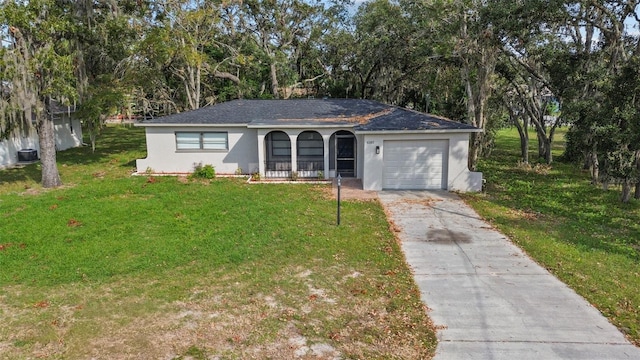 ranch-style home with a front yard, a garage, and covered porch