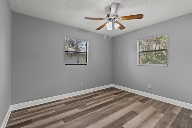 unfurnished room featuring hardwood / wood-style floors and a wealth of natural light