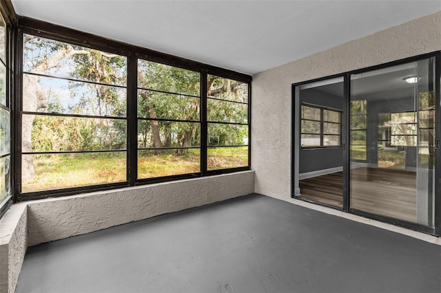 unfurnished sunroom with a healthy amount of sunlight