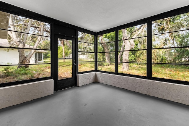 unfurnished sunroom featuring plenty of natural light