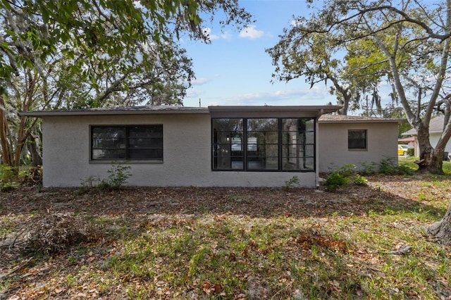 back of house with a sunroom