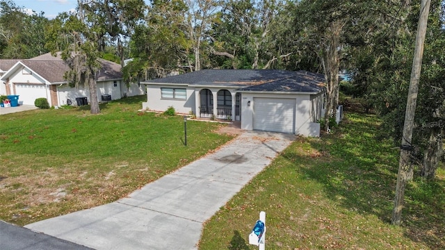 single story home featuring a front yard and a garage