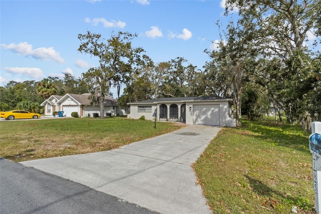 single story home with a front yard and a garage