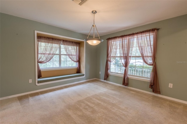 carpeted empty room with a healthy amount of sunlight