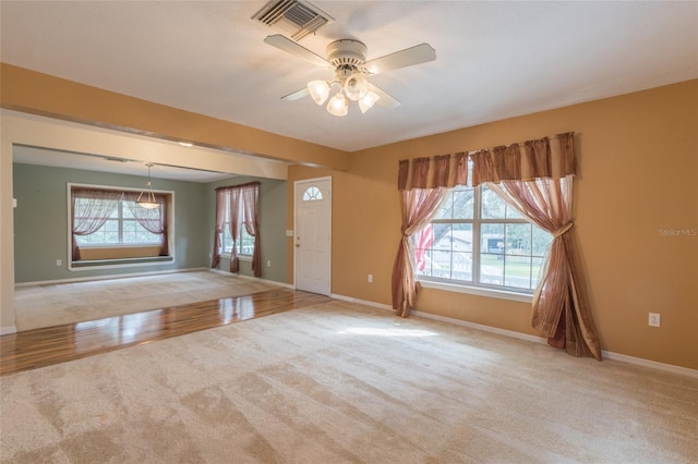 spare room with light hardwood / wood-style floors and ceiling fan