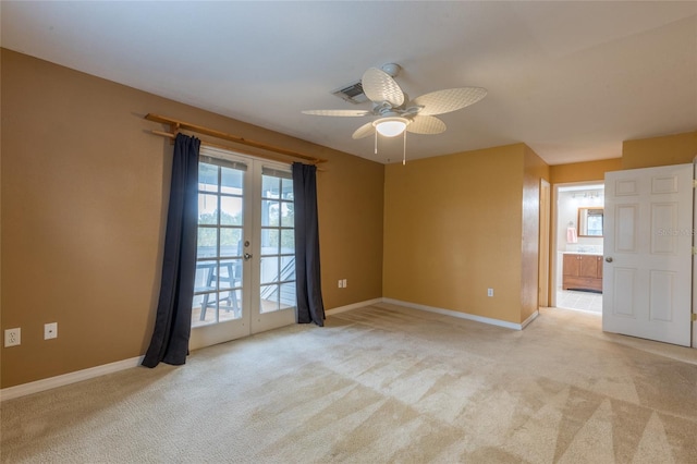 unfurnished room with french doors, ceiling fan, and light colored carpet