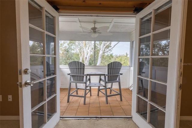 sunroom featuring french doors and ceiling fan