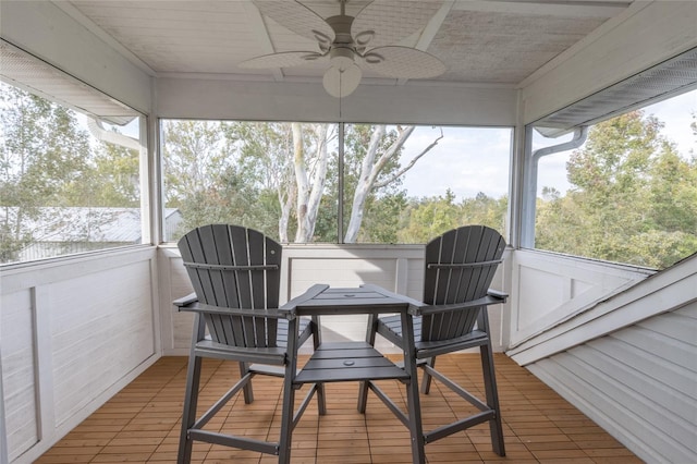 sunroom with ceiling fan and a healthy amount of sunlight