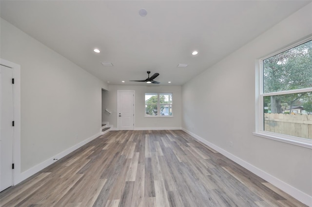 unfurnished room featuring ceiling fan and light hardwood / wood-style floors