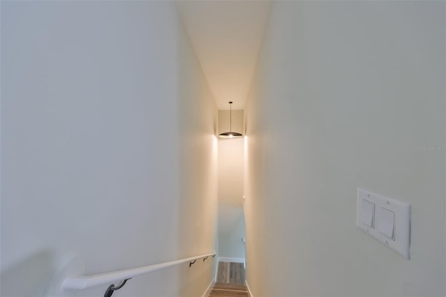 staircase featuring hardwood / wood-style flooring