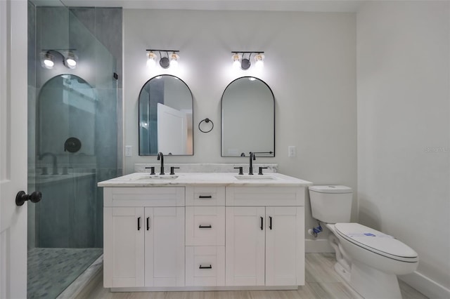 bathroom featuring toilet, an enclosed shower, vanity, and hardwood / wood-style floors