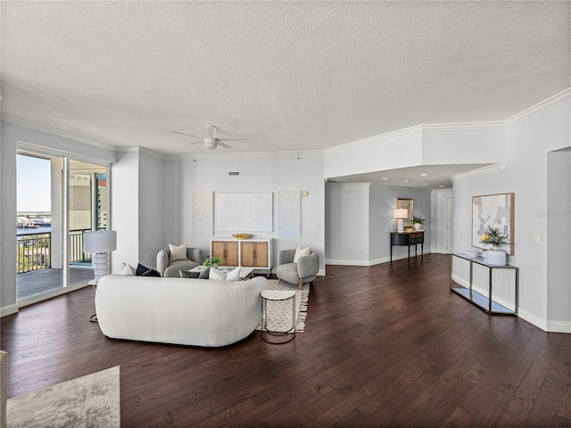 living room featuring crown molding, a textured ceiling, and dark hardwood / wood-style flooring