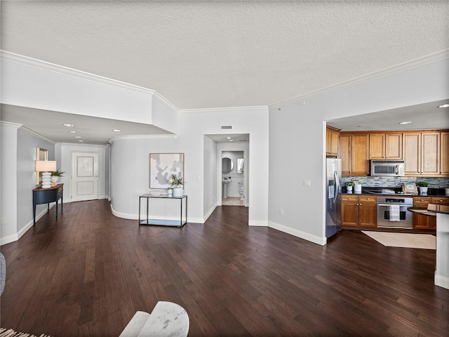 living room with ornamental molding, a textured ceiling, and dark hardwood / wood-style floors