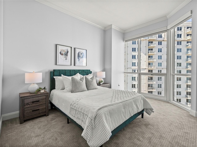 bedroom featuring carpet floors, ornamental molding, and baseboards