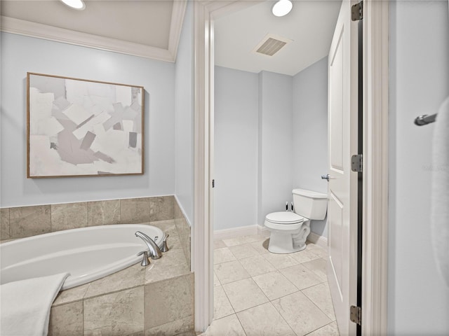 bathroom with crown molding, tiled tub, toilet, and tile patterned flooring