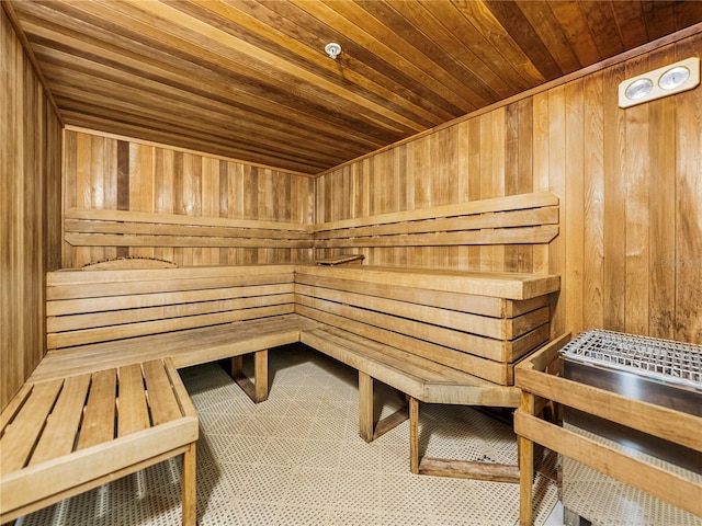 view of sauna / steam room with wooden walls and wooden ceiling