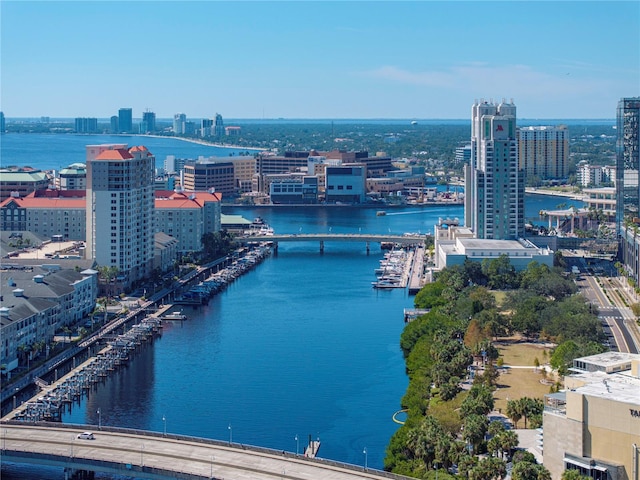 birds eye view of property featuring a water view and a view of city