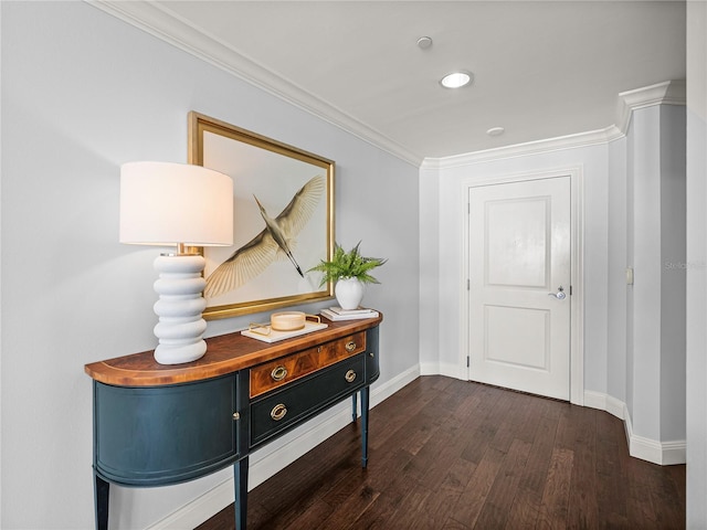 interior space with baseboards, ornamental molding, dark wood finished floors, and recessed lighting