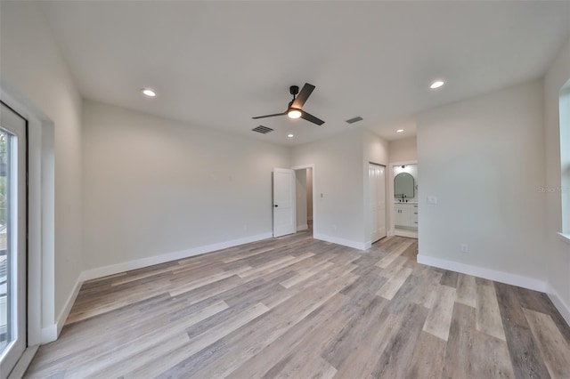 unfurnished room featuring ceiling fan and light hardwood / wood-style flooring