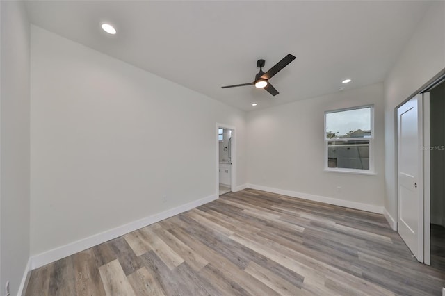 unfurnished bedroom with ceiling fan and light hardwood / wood-style floors