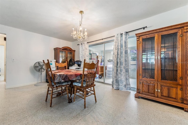 dining area featuring a chandelier