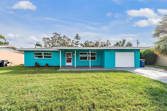 ranch-style house with a garage and a front lawn