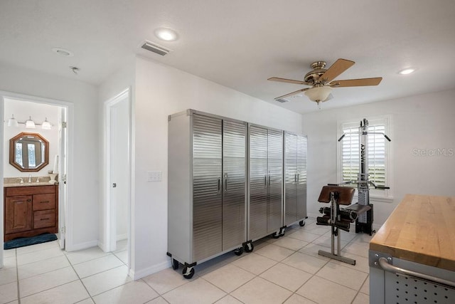 tiled home office featuring sink and ceiling fan