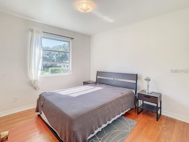 bedroom with hardwood / wood-style flooring