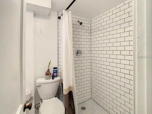 bathroom with toilet and walk in shower