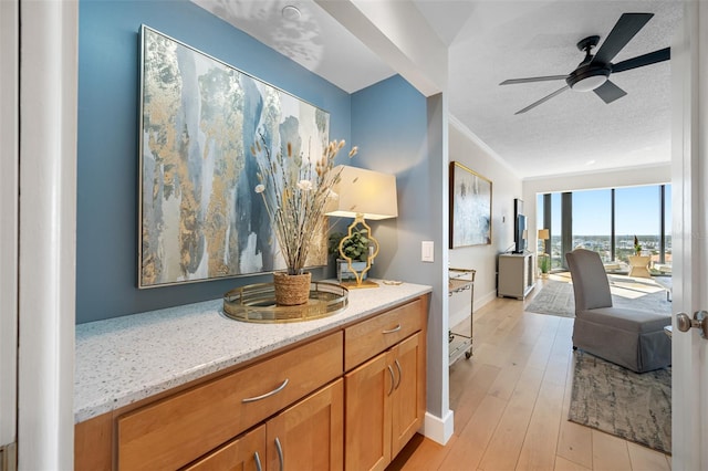 interior space with light hardwood / wood-style flooring and a textured ceiling