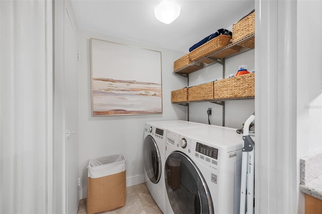 washroom featuring light tile patterned flooring and separate washer and dryer