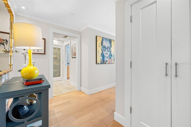 hallway featuring crown molding and hardwood / wood-style flooring