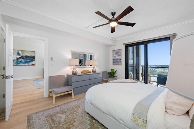 bedroom featuring access to exterior, ornamental molding, light wood-type flooring, a textured ceiling, and ceiling fan