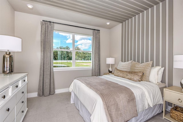 bedroom featuring light colored carpet