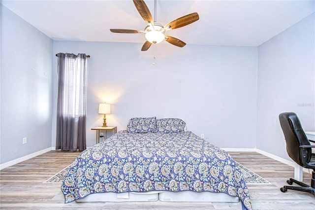 bedroom featuring ceiling fan and hardwood / wood-style flooring