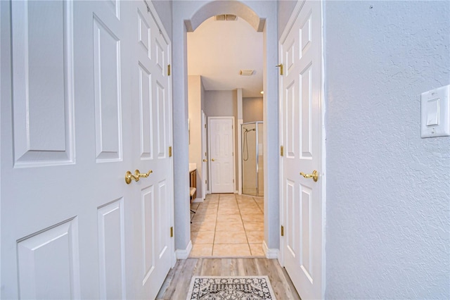 hallway with light wood-type flooring