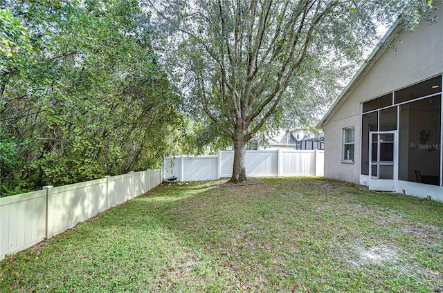 view of yard featuring a sunroom