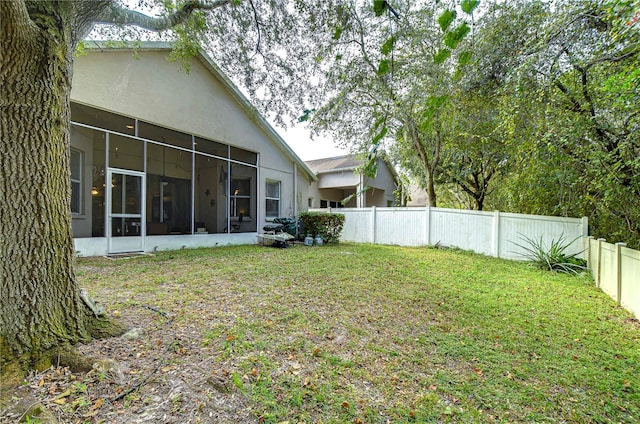 view of yard with a sunroom