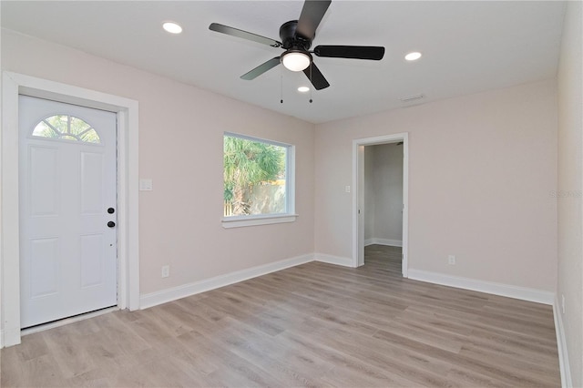 entryway with baseboards, light wood-type flooring, visible vents, and recessed lighting