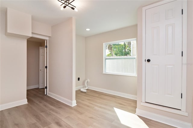 interior space featuring recessed lighting, light wood-style flooring, and baseboards