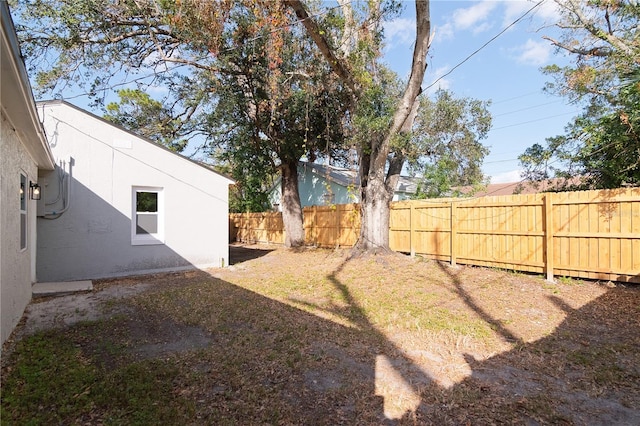 view of yard with a fenced backyard