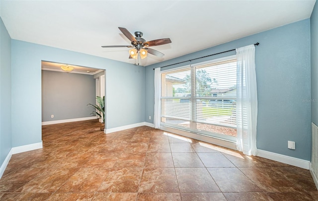 unfurnished room featuring ceiling fan