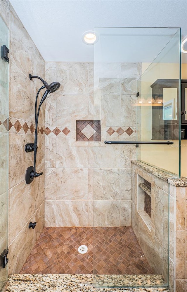 bathroom featuring an enclosed shower