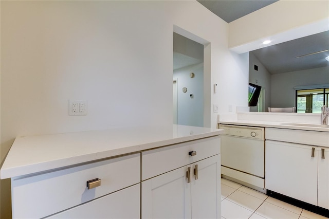 bathroom featuring vanity, vaulted ceiling, and tile patterned floors