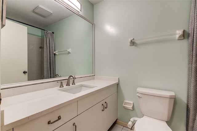 bathroom featuring toilet, vanity, a shower with shower curtain, and tile patterned flooring