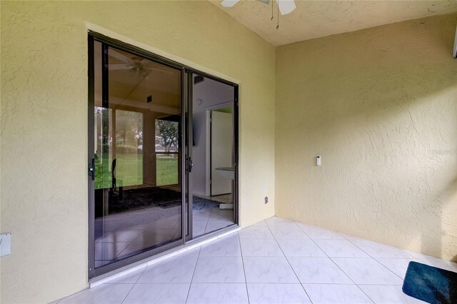 exterior space featuring ceiling fan