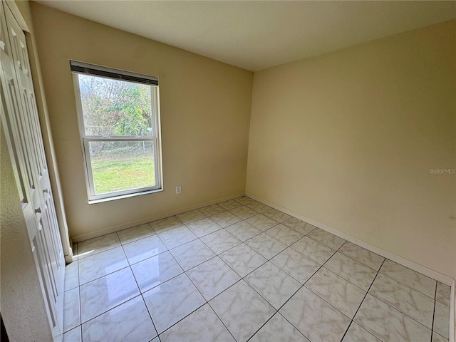 view of tiled spare room