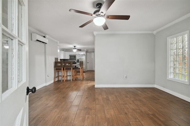 spare room with ceiling fan, crown molding, dark wood-type flooring, and a wall mounted AC