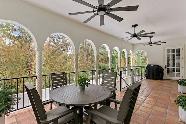 view of patio / terrace with a balcony, grilling area, and ceiling fan