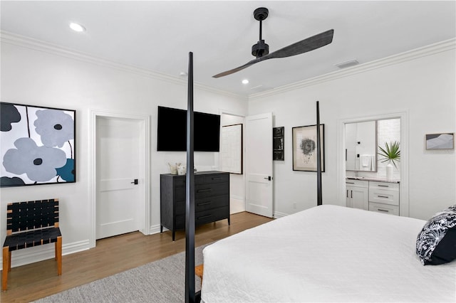 bedroom with ceiling fan, hardwood / wood-style flooring, ornamental molding, and ensuite bathroom